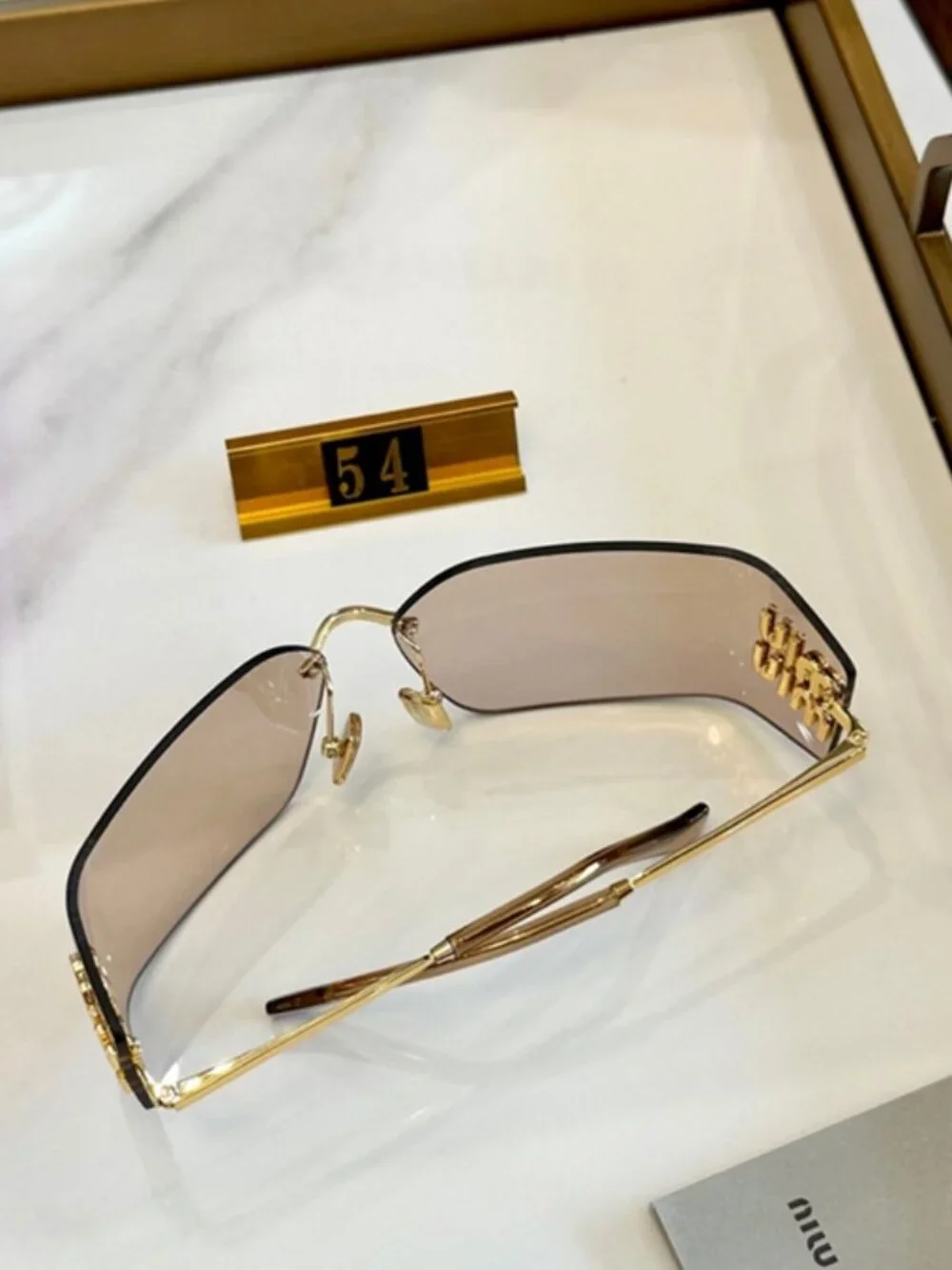 Miu Miu Rimless Square Sunglasses Logo Detail